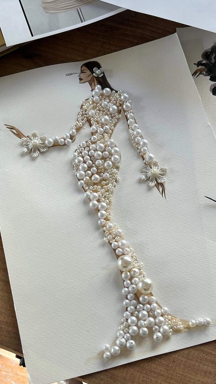 Fashion illustration of a woman wearing a pearl-encrusted mermaid gown on white paper.